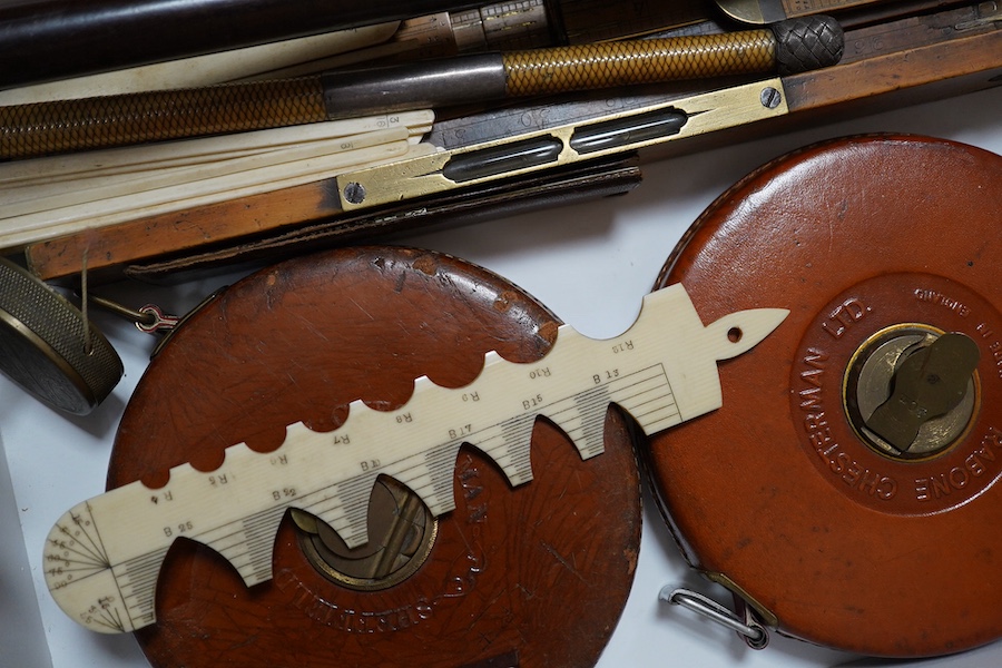 A group of 19th/20th century copper and brass measures, bone and wood rules etc. Condition - varies